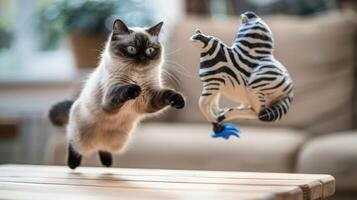 A playful cat leaps towards a toy zebra, showcasing its agility and curiosity. photo