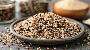 A close-up of a variety of colorful quinoa grains in a bowl, highlighting their texture and colors. photo