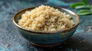 A bowl filled with cooked quinoa, showcasing its fluffy texture and light color. photo