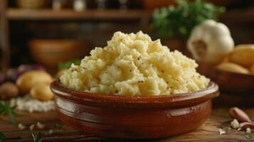 A bowl of creamy mashed potatoes garnished with spices, ready to serve as a side dish. photo
