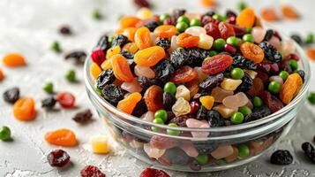 A bowl of mixed dried fruits and nuts, ideal for snacking or adding to recipes. photo