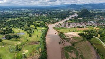 Aerial view of Mae Kok river flowing through Chiang Rai province of Thailand. This river is the blood line for people of Chiang Rai, started from the hills on boarder of Myanmar. photo