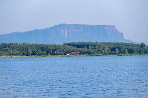 Phu Langka mountain look through Bueng Khong Long the largest frehwater reservoir in Bueng Kan province of Thailand. photo