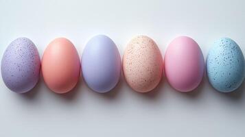 Minimalist Easter eggs in pastel colors arranged in row photo