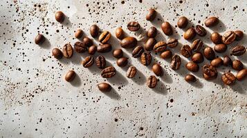 Minimalist composition of coffee beans scattered on textured surface photo