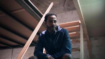 Reflective black man portrait looking to camera in an Urban Environment video