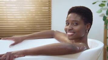Experience a Beautiful and Relaxing Bath with a Woman in a Tranquil Setting looking to camera video