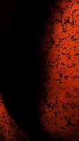 A Vibrant Red Abstract Texture Enhanced with Dark Particles Adding Depth and Interest video