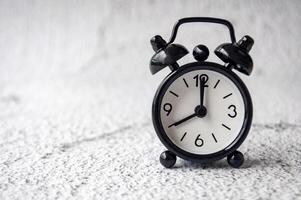 Table alarm close point at 8 am with space for text. Timer and copy space concept. photo