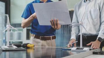 Two men are working on a solar panel video
