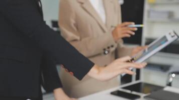 Two business people are using a tablet computer video