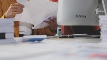 A person is looking at a document on a computer video