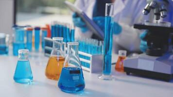 A scientist is working in a laboratory with several test tubes video