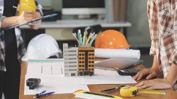 A man and woman working on a project at a desk video