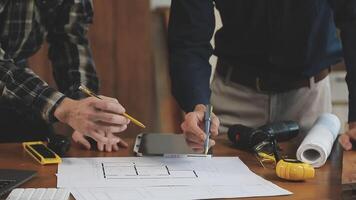 Two men working on a project at a table video