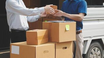 Two men are handing a box to another man video