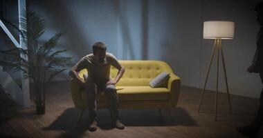 Two men on a couch interview scene talking podcast video