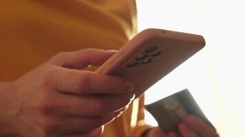 Woman hands shopping online holding smartphone paying with credit card. Girl buying on Internet enter credit card details. Online shopping ecommerce delivery service video