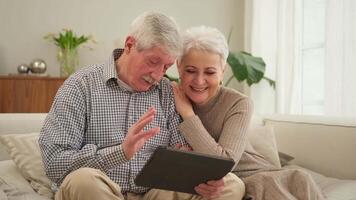 call. Happy senior couple woman man with tablet having call. Mature old grandmother grandfather talking speaking online. Older generation modern tech usage. Virtual meeting online chat video