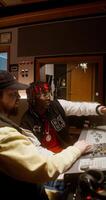 Two men in a recording studio with a mixer video