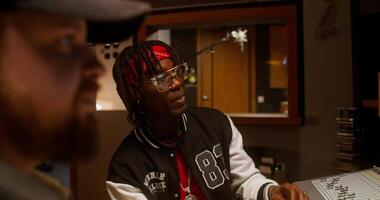 A man in a recording studio with another man video