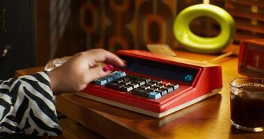 A person using a calculator on a desk video