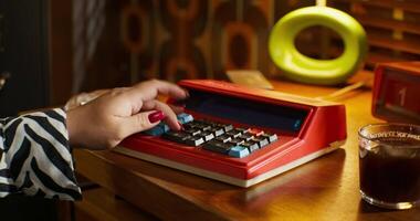 A person using a calculator on a desk video