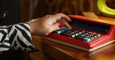 A person using a calculator on a desk video