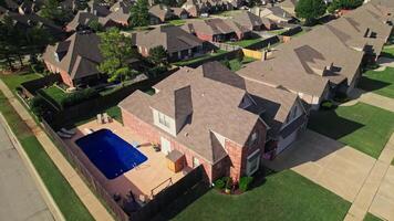 An aerial view of a neighborhood with a pool video