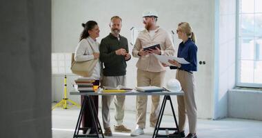 Three people standing in an unfinished room video