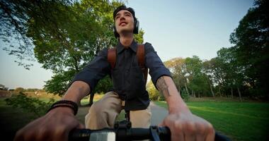 A man riding a bicycle in a park video