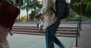 A man and woman walking down steps video