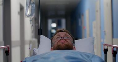 A man in a hospital bed with an iv drip video