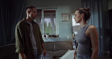 A man and woman standing in a living room video