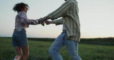 A man and woman dancing in a field video