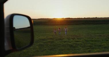A view of a field from a car window video