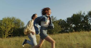 Two people running in a field video