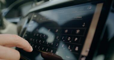 A person is using a tablet computer in a car video