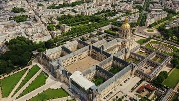Architectural complex and park area of Les Invalides in the historic center of Paris, bird's eye view on a cloudy day. Cityscape of Paris from drone video