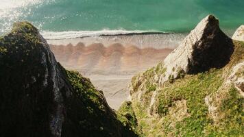 An aerial view of a beach and cliffs video
