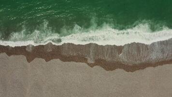 An aerial view of the ocean and sand video