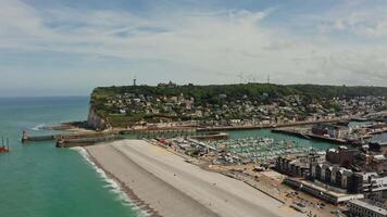 An aerial view of a beach and a harbor video