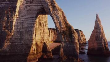 The rock formations at the beach are tall and tall video