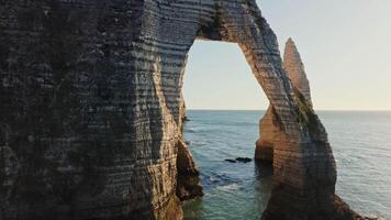 A large rock formation with a window in it video