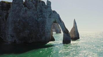 The rock formations are very tall and have three pillars video