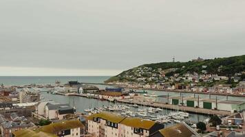 A view of a harbor with boats and buildings video