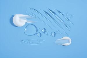 Drops and smears of cosmetic products on a blue background. photo