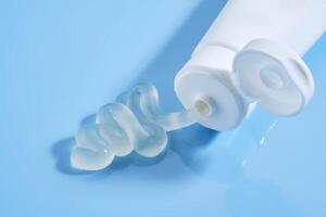 Gel toothpaste in a tube on a blue background. photo