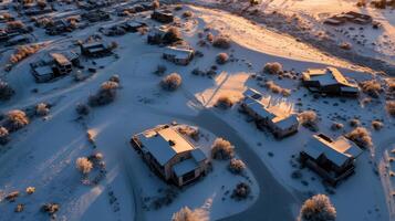 Aerial view of a snowy village at sunset photo