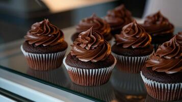 Delicious chocolate cupcakes with rich ganache frosting displayed beautifully photo